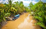 Kanal mit Boten im Mekong Delta, Ben Tre